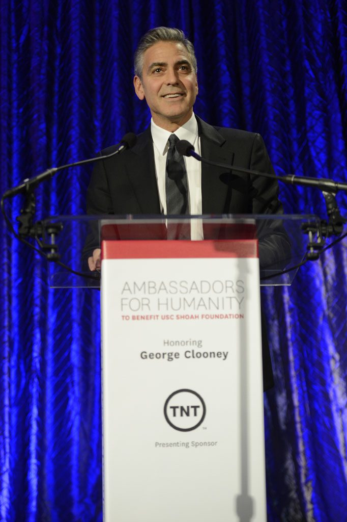 A man standing at the top of a podium.